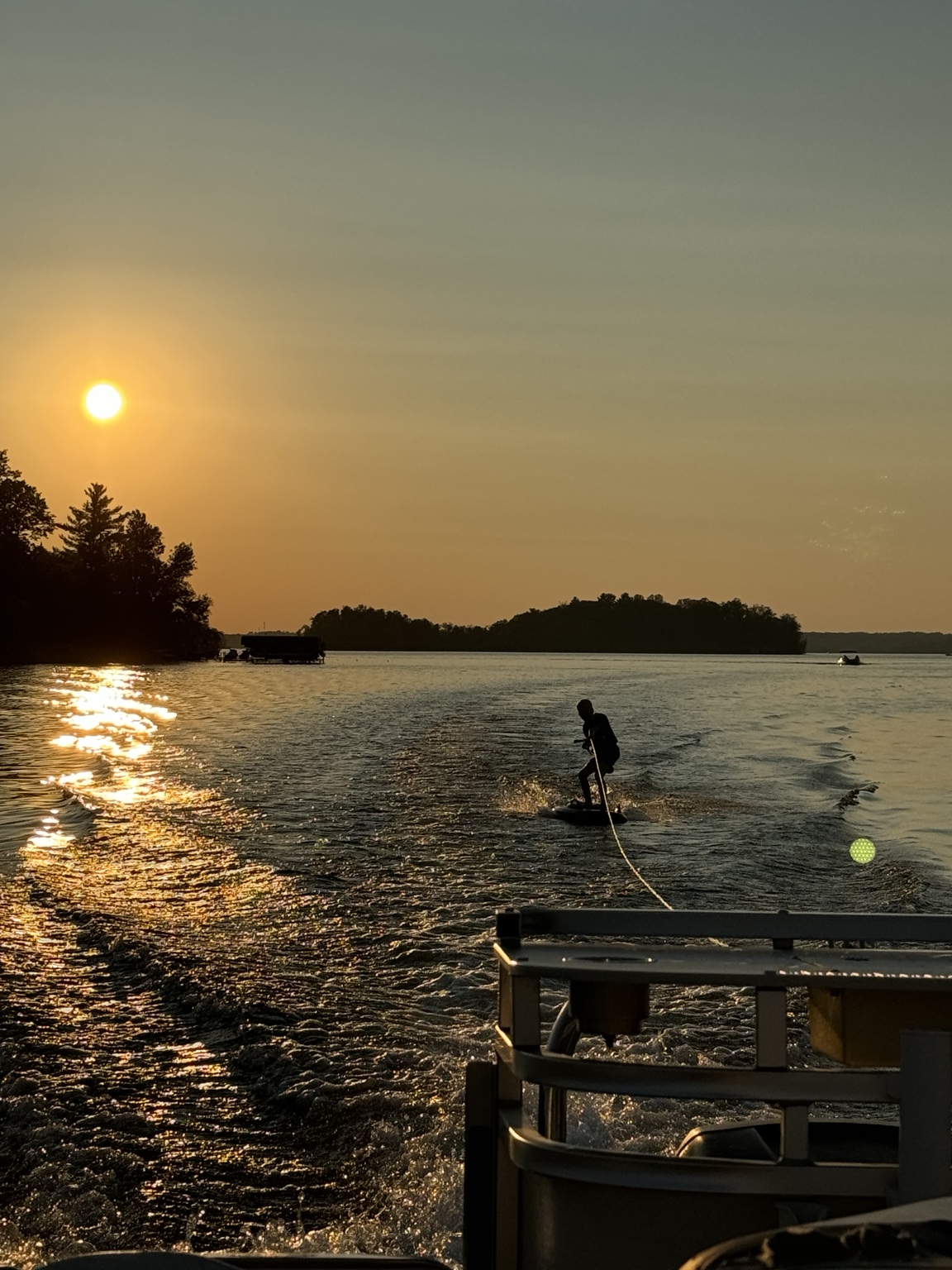 Waterskiing at sunset on a northern Minnesota lake